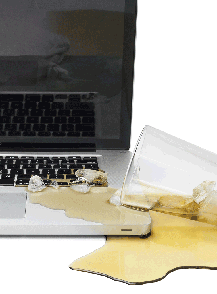 laptop has spilt drink on keyboard with ice cubes